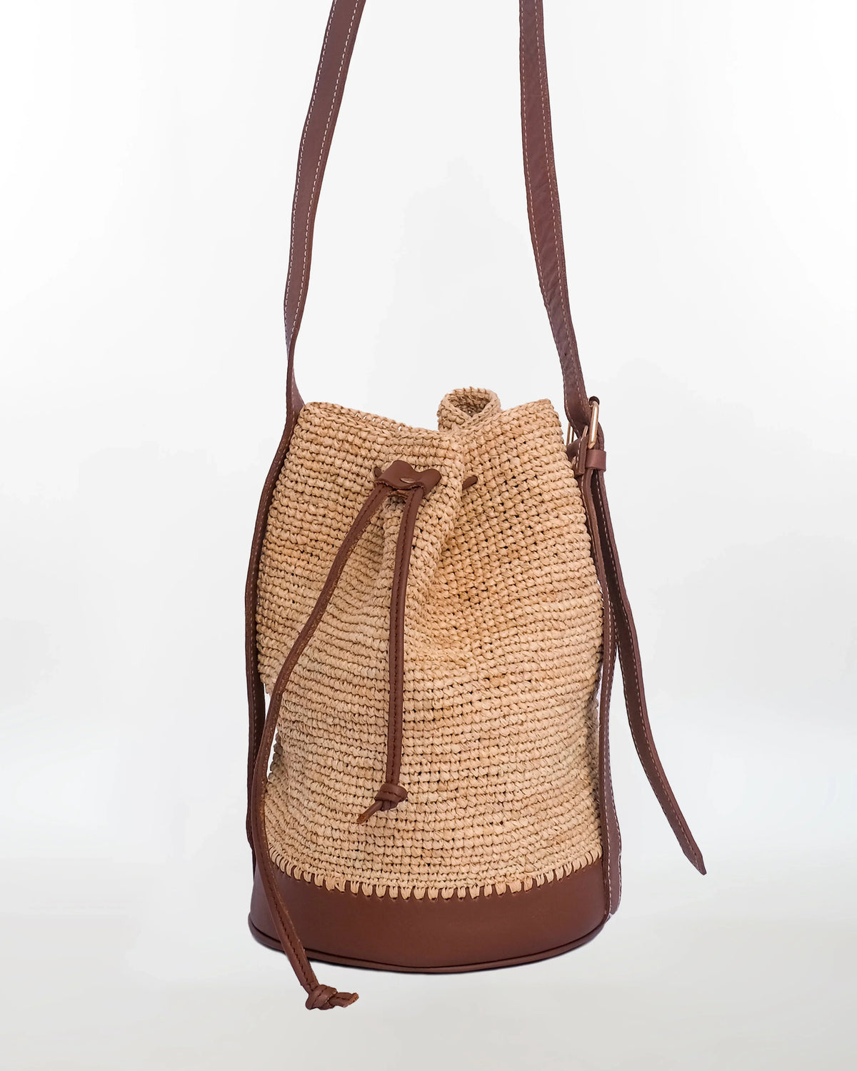 Jemure Handwoven Raffia Bucket Bag with Leather Base & Drawstring Closure – Natural